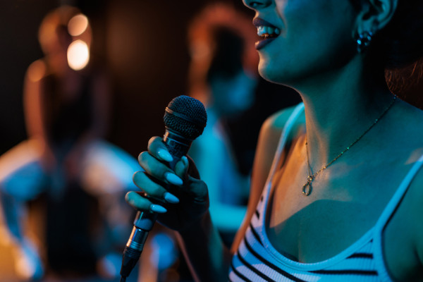 A woman holding a microphone