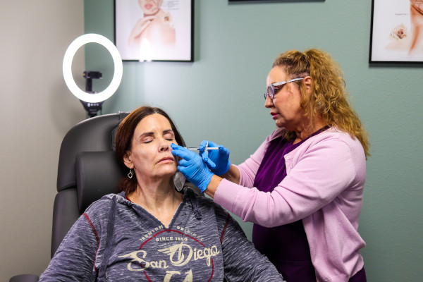 Joplin ENT's Ginnie Grimm performing a filler treatment on a patient