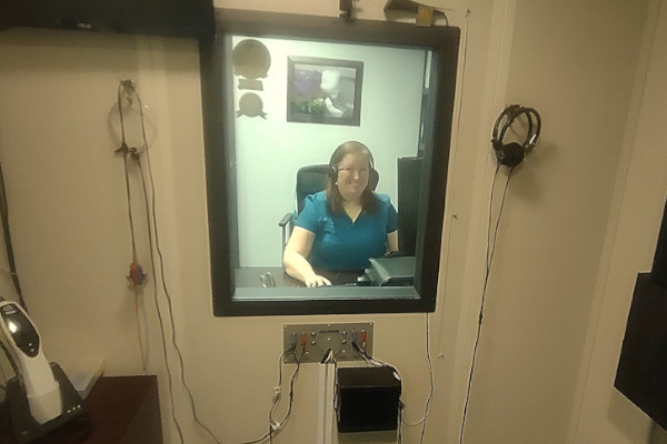 Dr. Long performs a hearing test