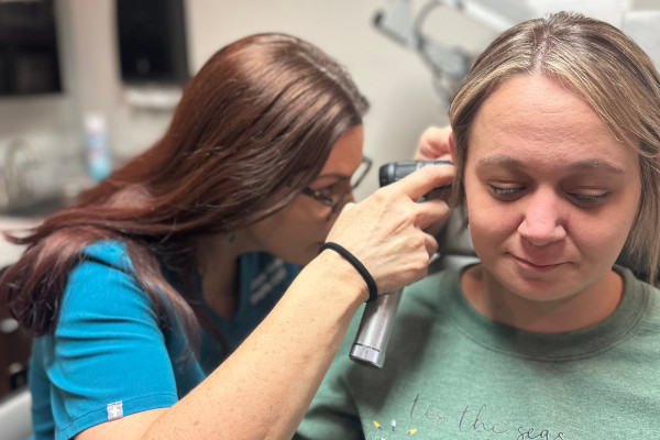 Dr. Walker of Joplin ENT performing an ear exam